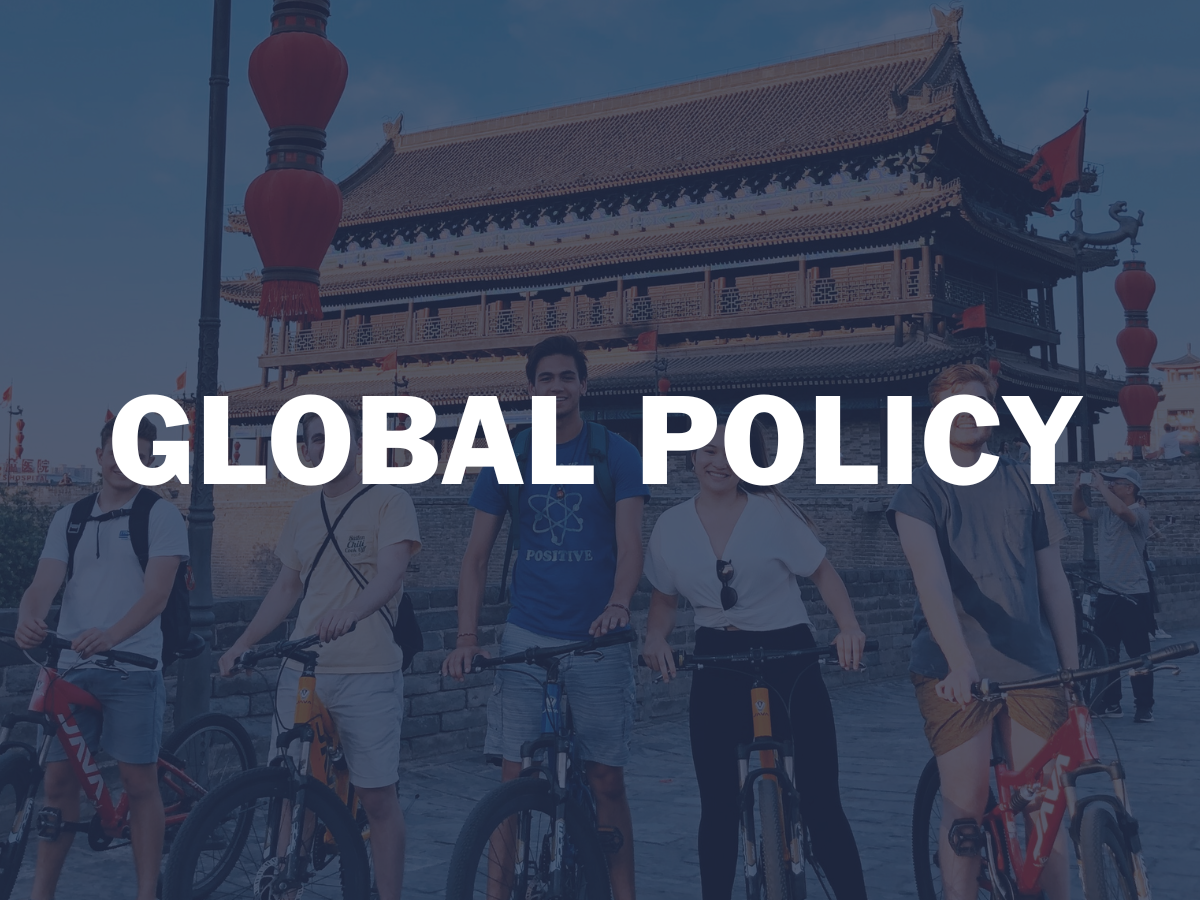 Batten UVA Global Policy Image featuring students on bikes on a trip abroad. 