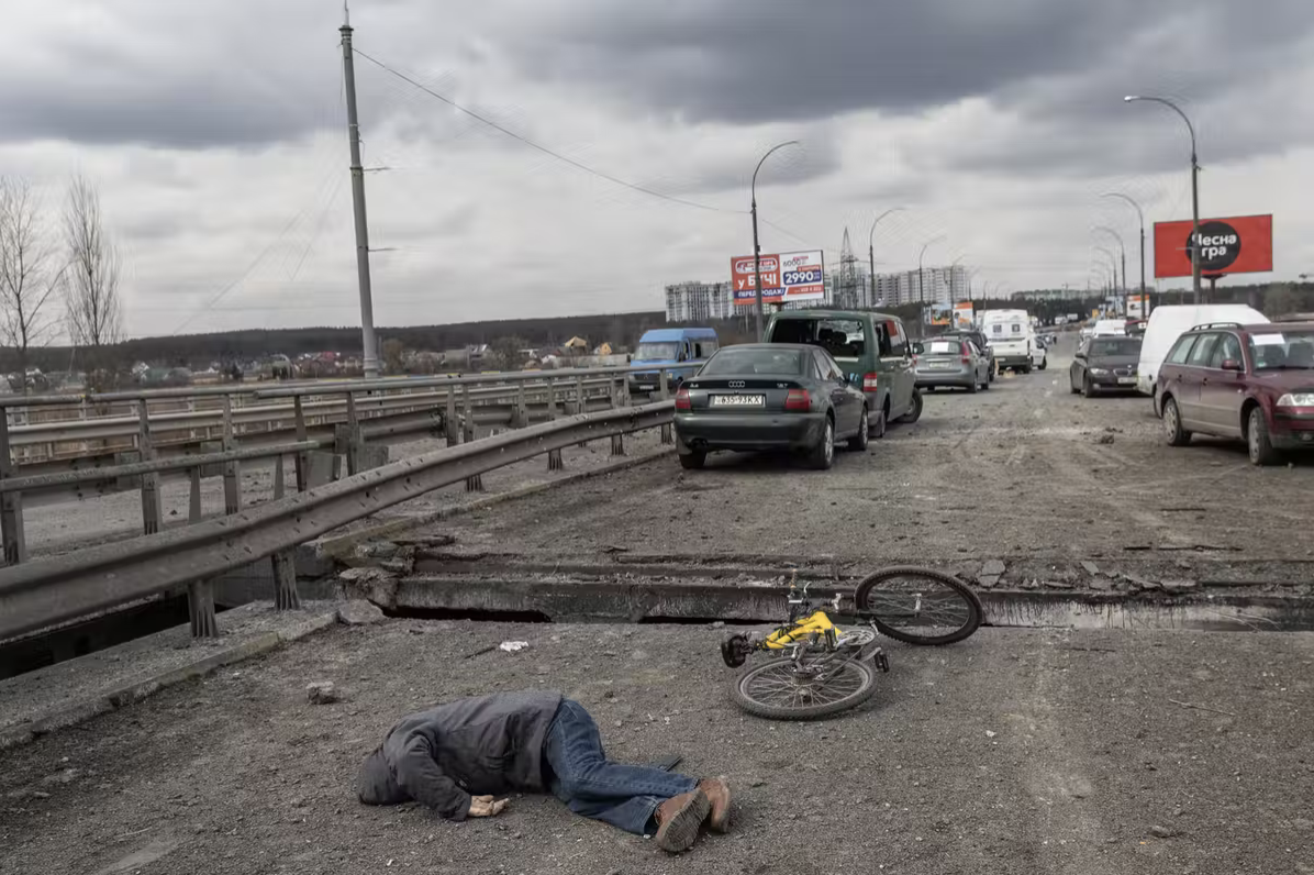 The body of a civilian is seen on a destroyed bridge used to evacuate residents from Irpin, Ukraine, on March 7, 2022. Chris McGrath/Getty Images