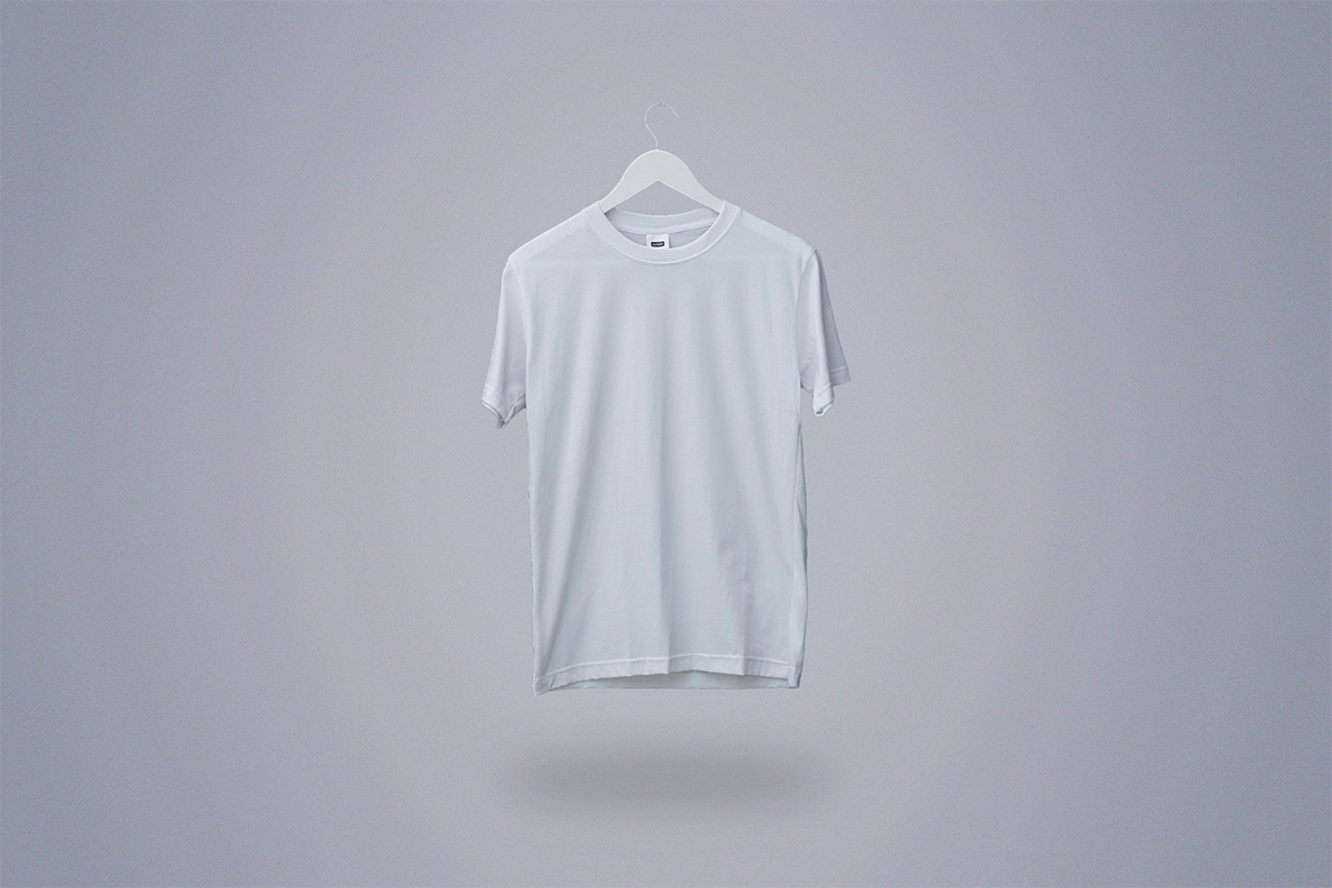 White t-shirt on a hanger floating in a white room