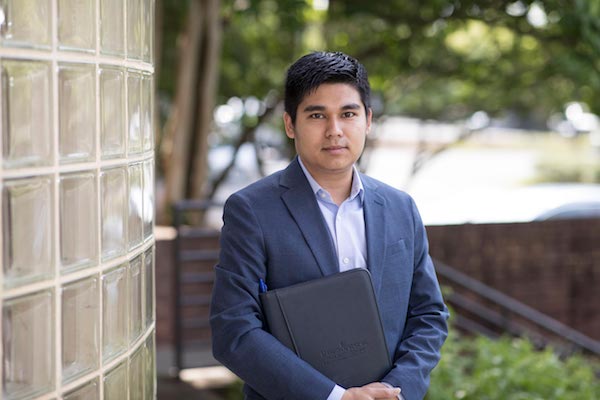 Kyaw Khine, a research and policy analyst at UVAâs Weldon Cooper Center for Public Service, released a new report showing a marked increase in bachelorâs and advanced degrees. (Photo by Dan Addison, University Communications)