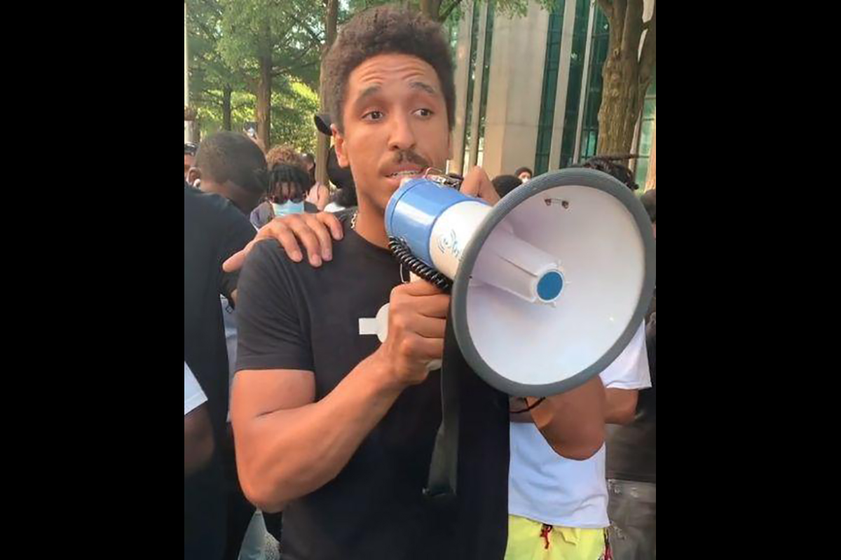 Greater Atlanta Christian grad and NBA player Malcolm Brogdon speaks to the crowd during a protest march Saturday in Atlanta.