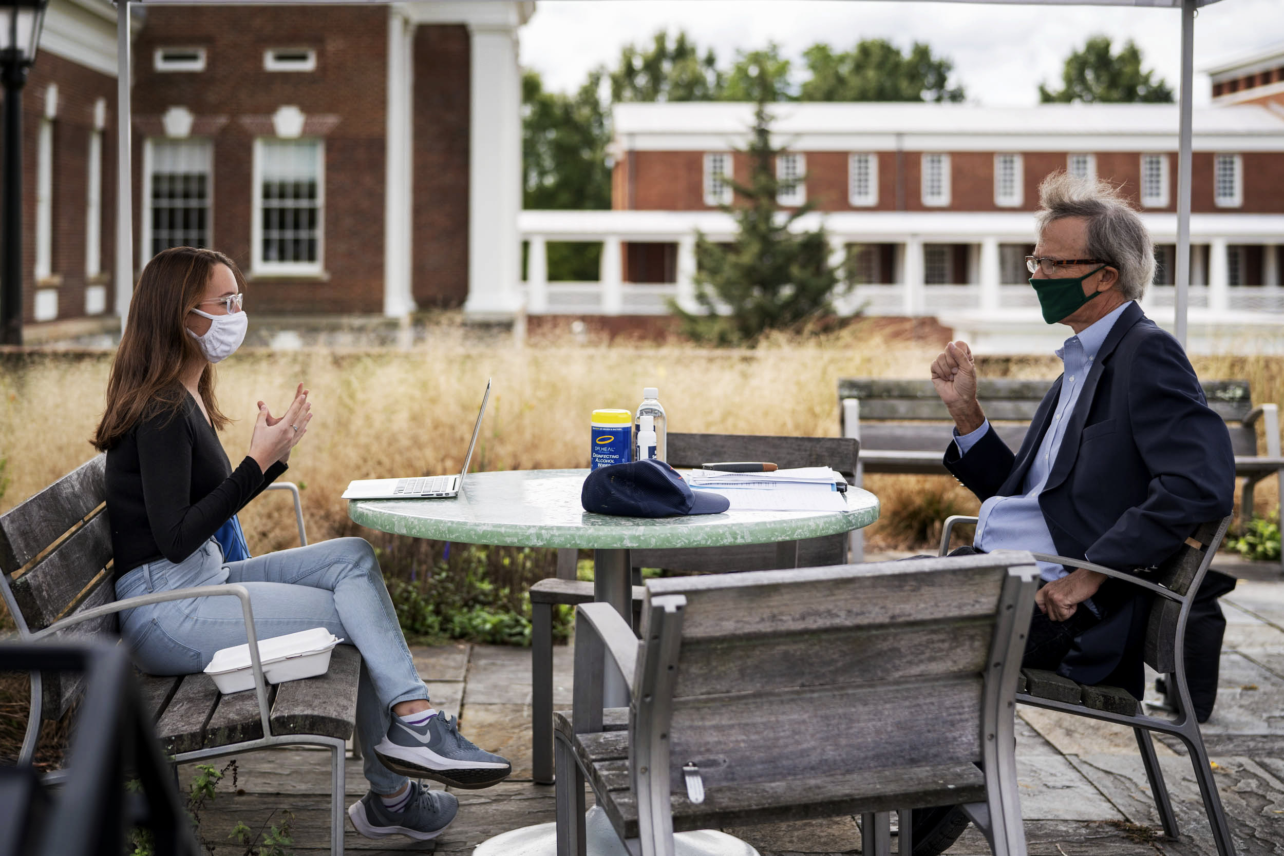 Professors have had to get creative with their office hours. Professor of practice Gerald Warburg of the Frank Batten School of Leadership and Public Policy meets with students under a tent atop the Batten Schoolâs green roof.