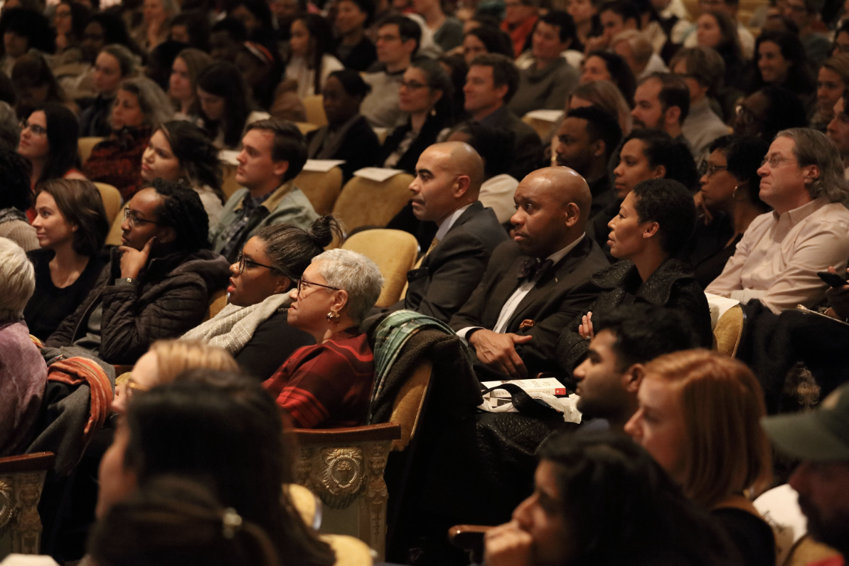 Audience members listening to Roxane Gay