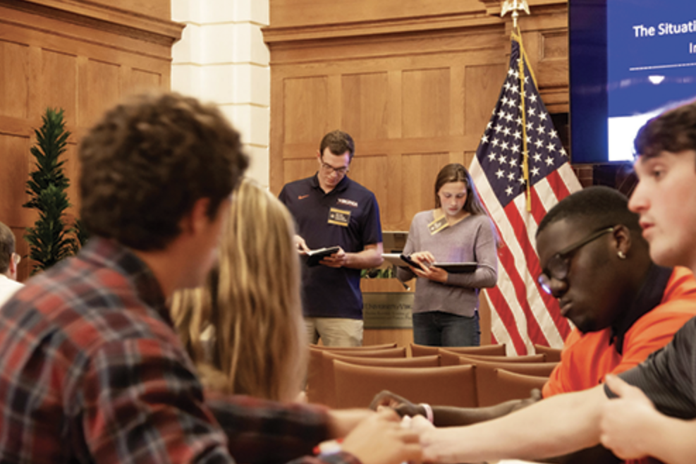students from the University of Virginia’s (UVA) Athletics Leadership Program participated in a simulation in which they acted as White House crisis personnel, intelligence agents, and members of the media responding to an assassination attempt on the U.S. president. 