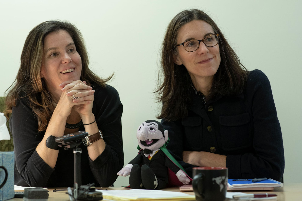 Frank Batten School of Leadership and Public Policy professors of practice Kirsten Gelsdorf and Lucy Bassett with “Sesame Street” character Count Von Count. (Photo by Dan Addison, University Communications)