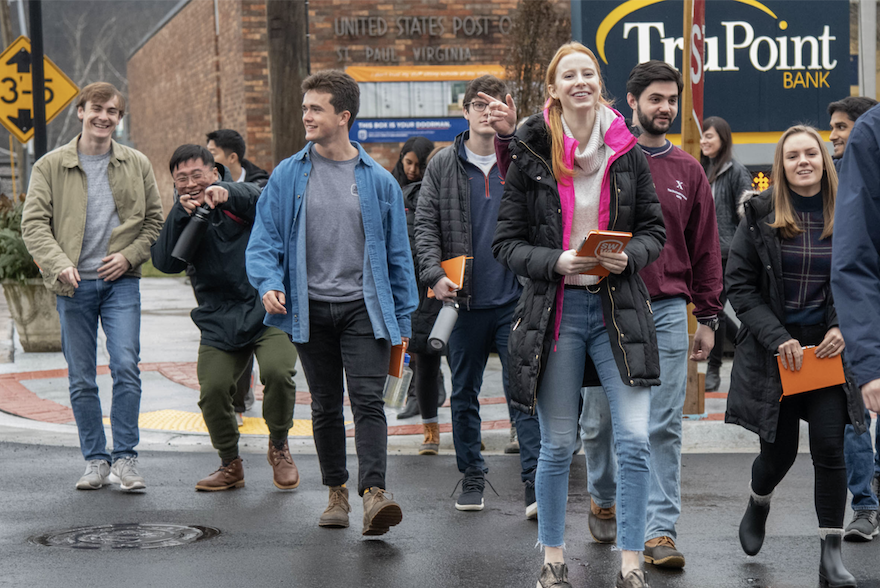 Students in Mahoney’s J-Term class walk in downtown St. Paul, Virginia. Behind them is the newly opened Western Front Hotel, which was a historic building restored through impact investing.