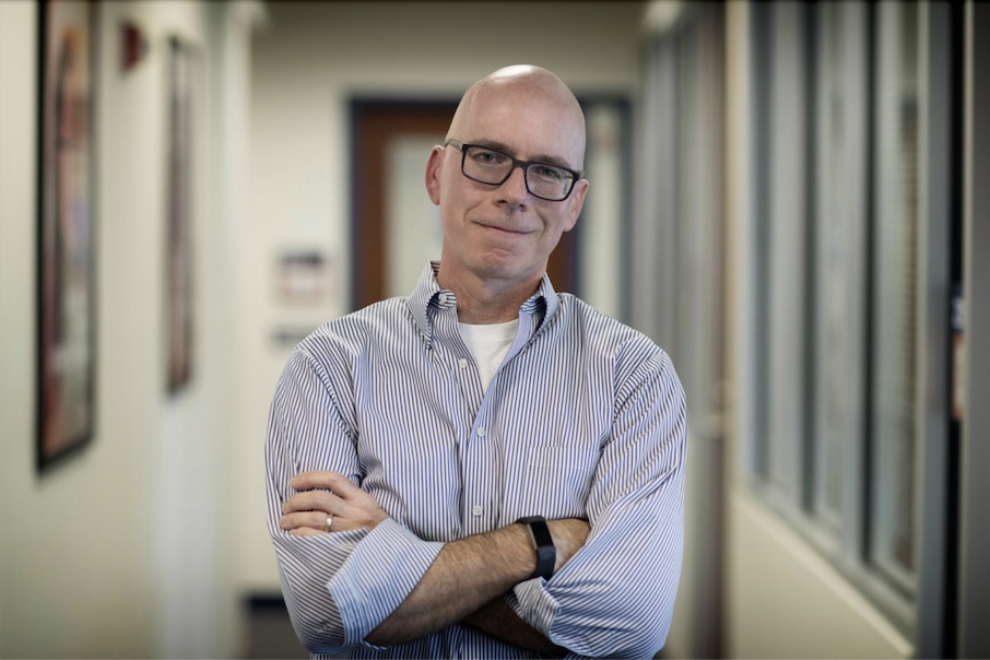 Tim Davis is an associate professor of public policy and clinical psychologist who studies team leadership and emotional resilience. (Photo by Dan Addison, University Communications)