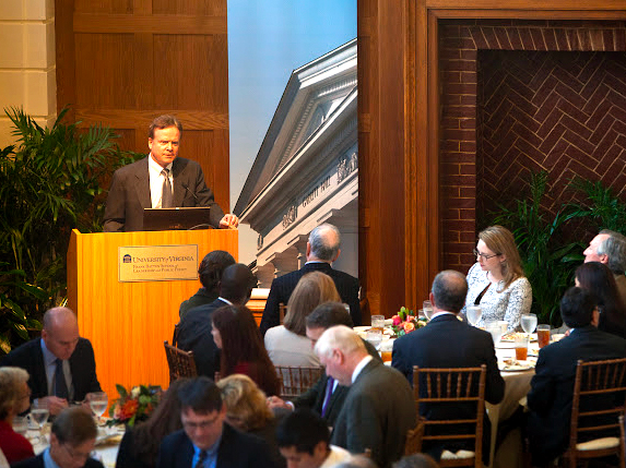Man speaks at a podium