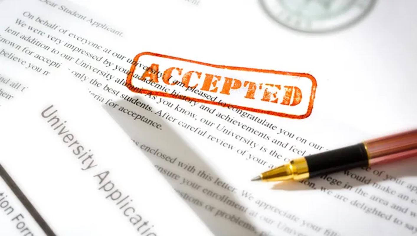 Pen on a college application stamped 