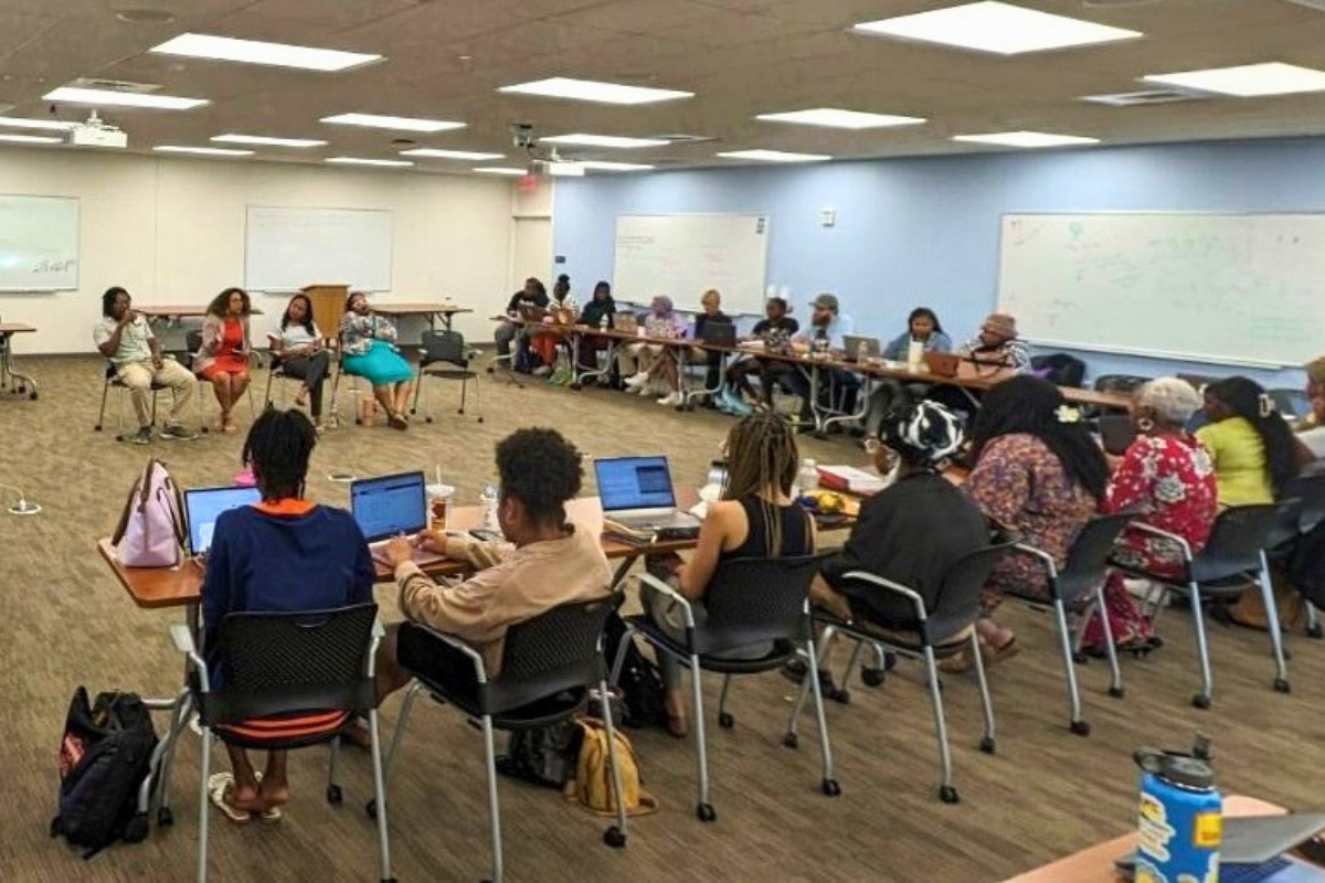 Photo of open doors participants in session